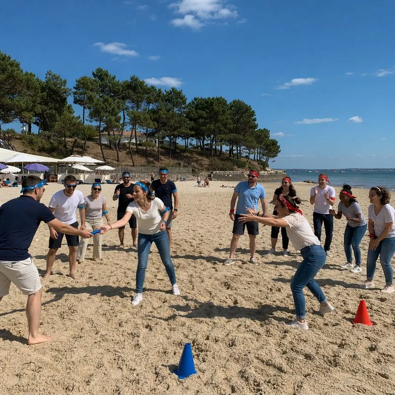 Équipes en pleine épreuve d'Olympiades sur une plage du Bassin